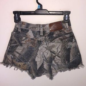 Camo wrangler jean shorts size 23, or size XS.